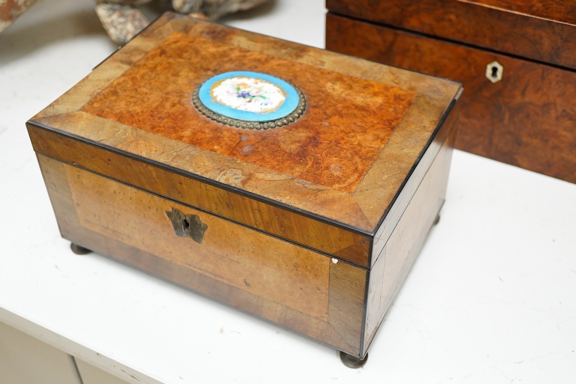 A 19th century burr walnut work box and a French burr wood and Sevres style porcelain mounted work box, 30.5cm wide x 14cm high.